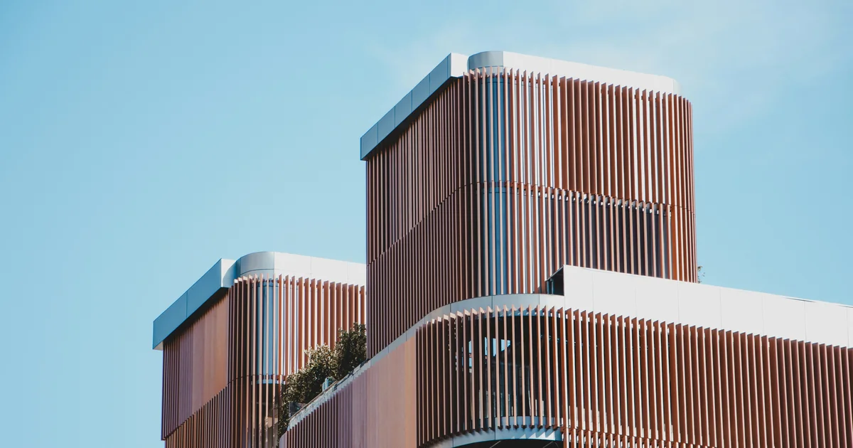 A modern office building exterior, representing a Qatar permit office appointment