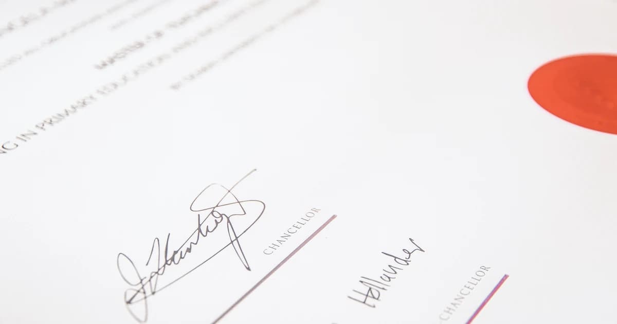 An official certificate document with a red wax-style seal and signatures