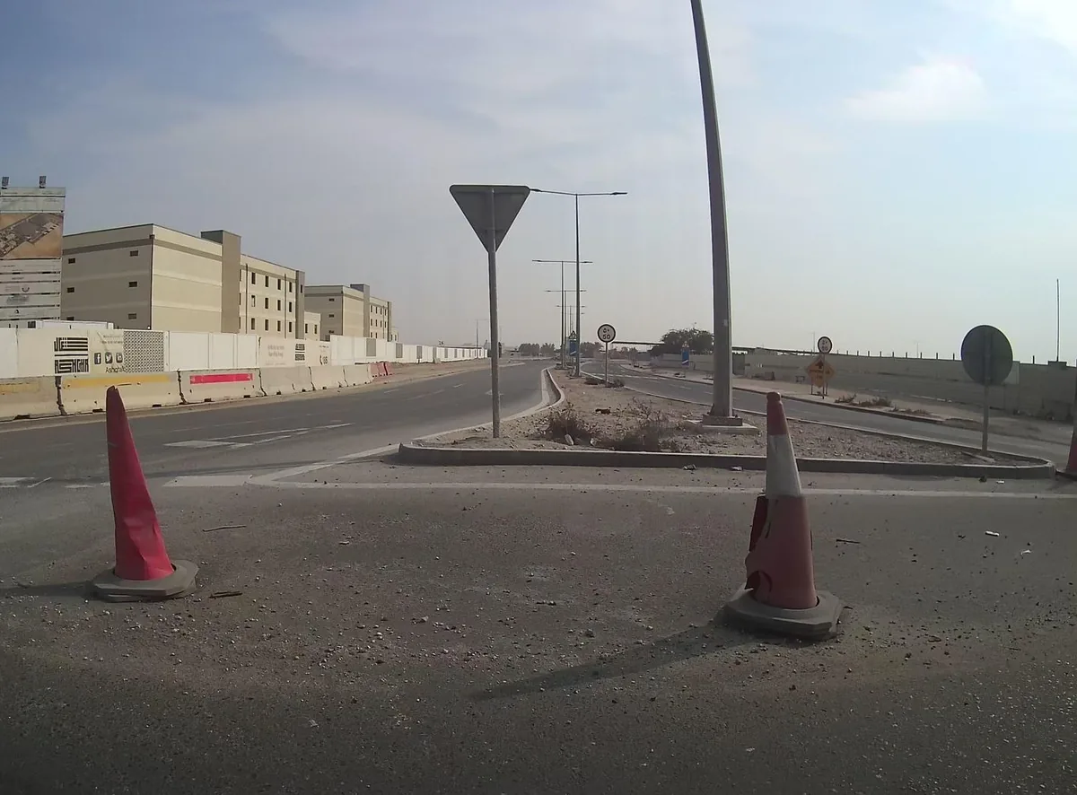 Road through the Wadi Al Banat district of Al Daayen, Qatar, the area where the MOI passports complex is located