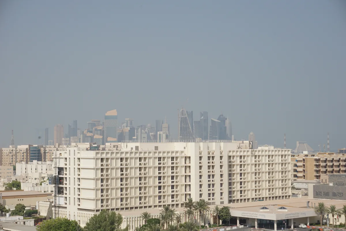 The Surgical Specialty Center building at Hamad Medical City in Doha with the Doha skyline behind it